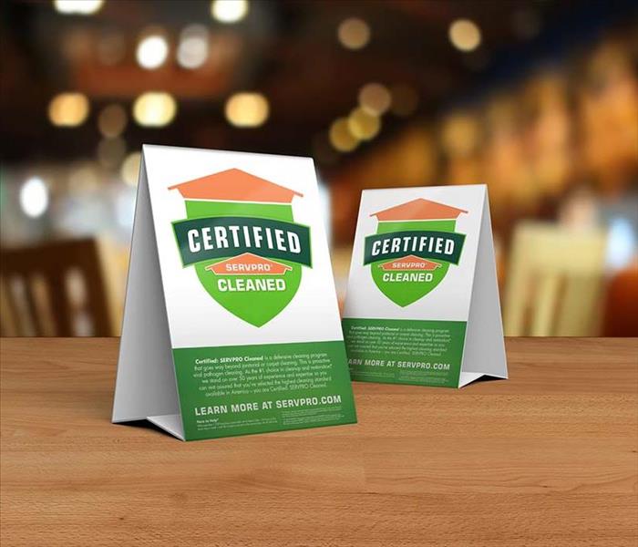 Certified: SERVPRO Cleaned table toppers on table in business